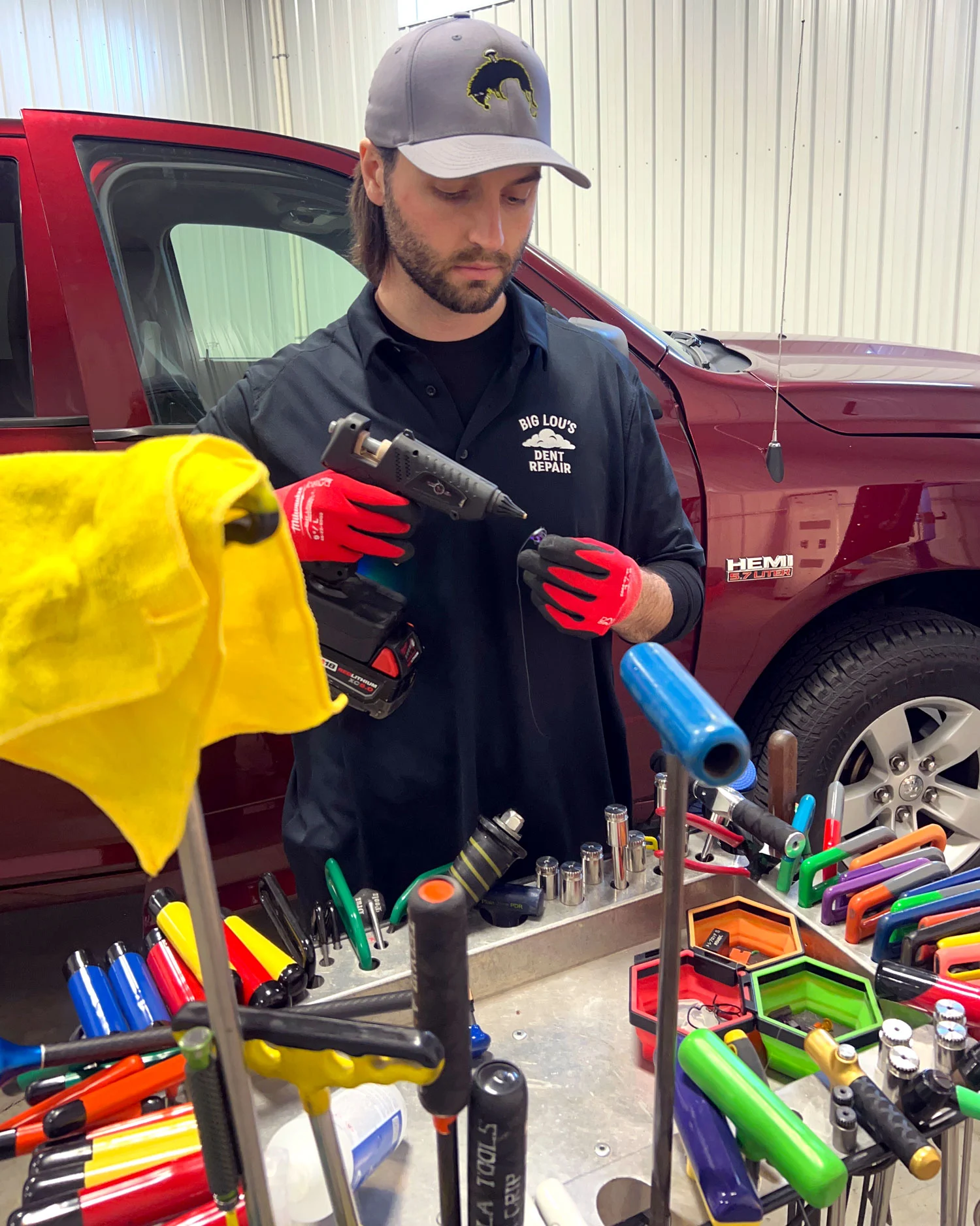 Big Lou fixing hail damage in his Sioux Falls shop