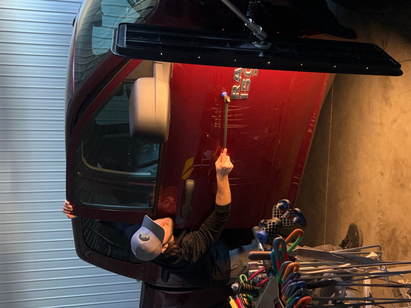 Big Lou repairing a door dent with PDR tools