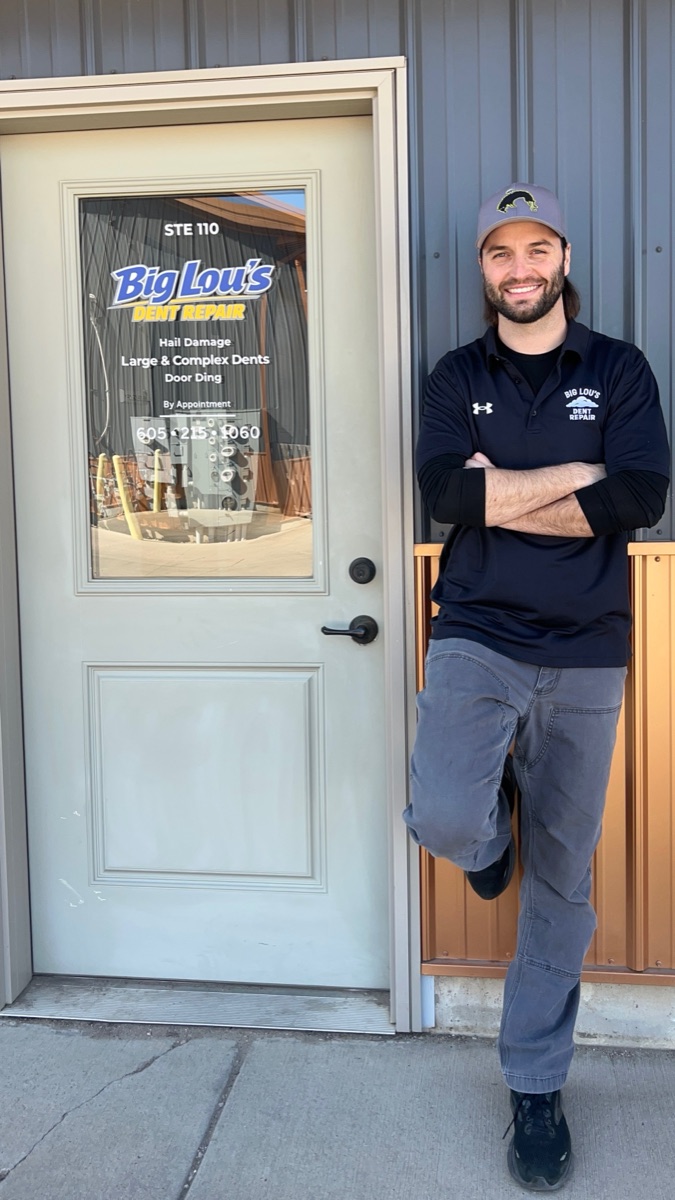 Big Lou outside his Sioux Falls dent repair shop