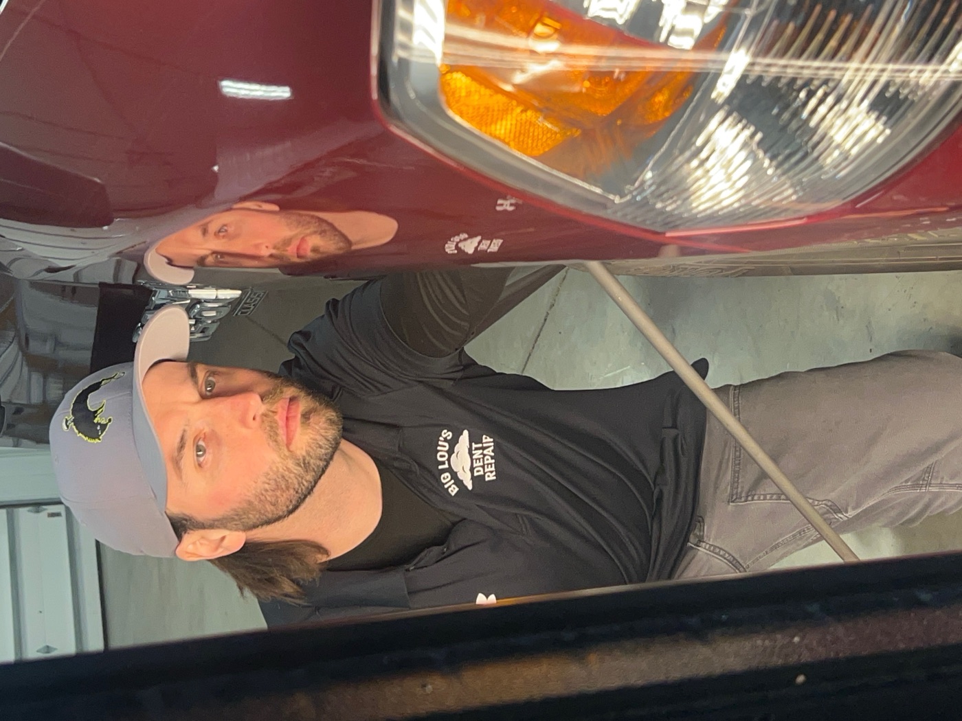 Big Lou with paintless dent repair tools in his Sioux Falls shop